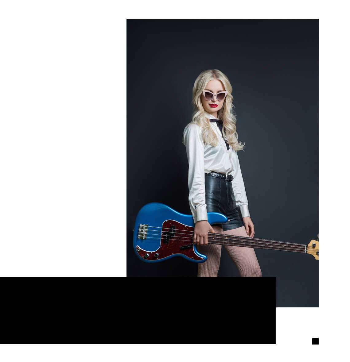 Jennie Vee with bass guitar while wearing her collaboration sunglasses by Valley Eyewear